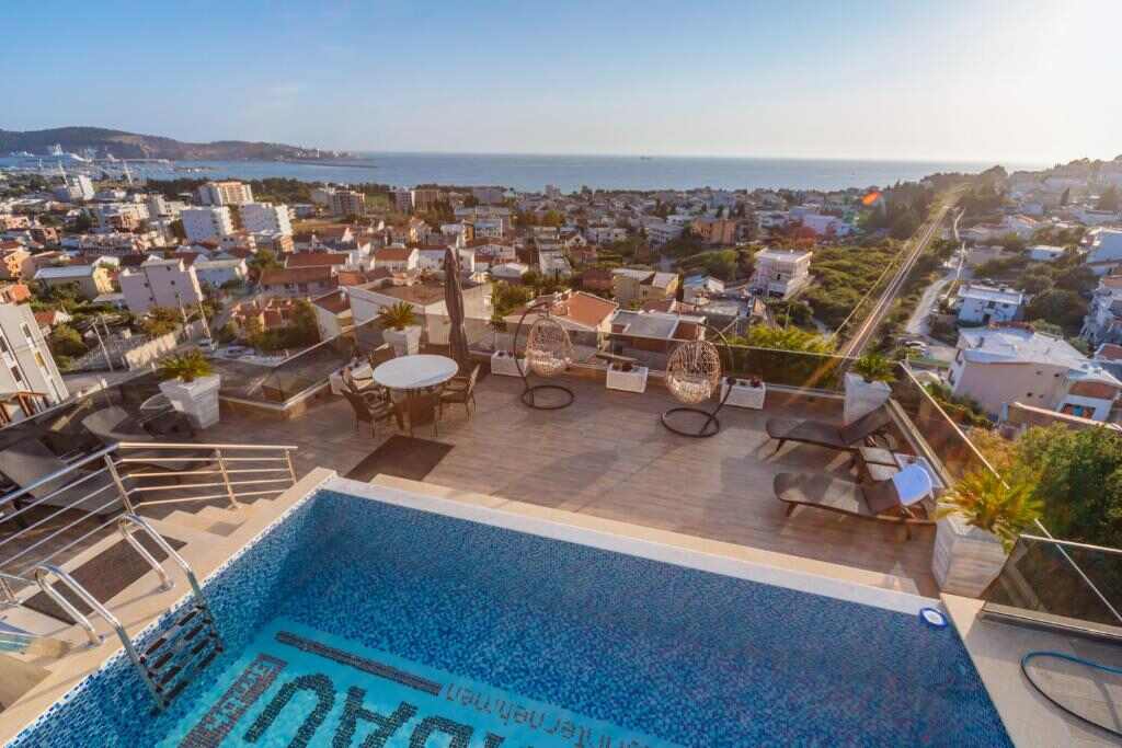 Rooftop terrace and pool at Hotel MS overlooking the sea